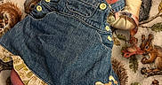 Iris is registered to the contest to win money with this photo: newborn, baby, sleeping, denim_dress, white_shoes, striped_hat, plush_toy, blanket, squirrel_pattern, infant, cute, cozy, soft, peaceful, child, clothing, footwear, portrait, indoors, resting
