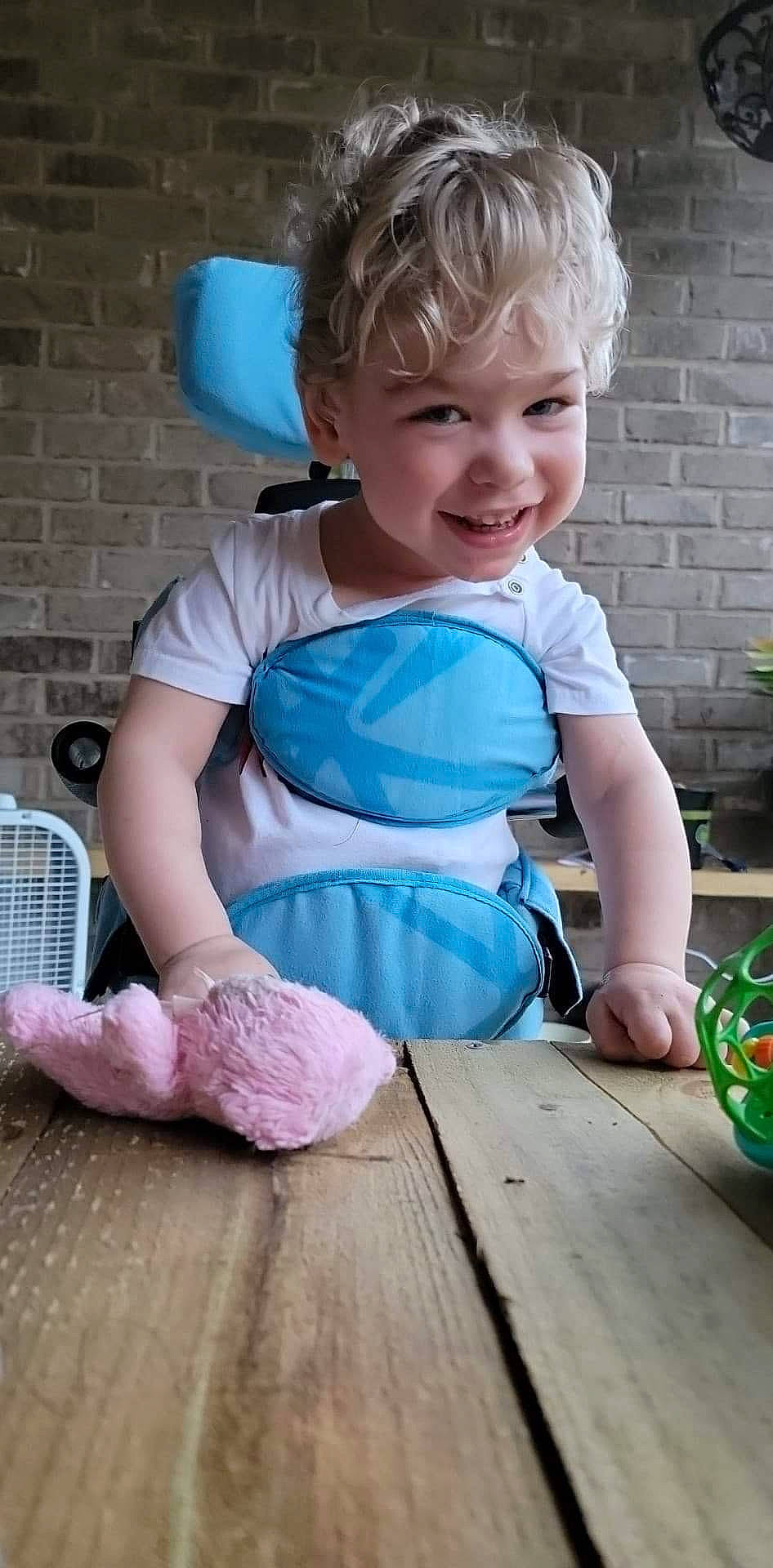 Henry is registered to the contest to win money with this photo: baby, baby_products, baby_toddler_clothing, chair, child, electric_blue, fun, green, happy, hardwood, houseplant, joy, leisure, pattern, person, pink, play, sitting, smile, toddler