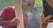 Noah joined the competition — help win amazing prizes! child, pajamas, spiderman, door, screen, hand, smartphone, person, playful, curious, indoors, window, glass, fingers, sleeve, red, blue, casual, portrait, young