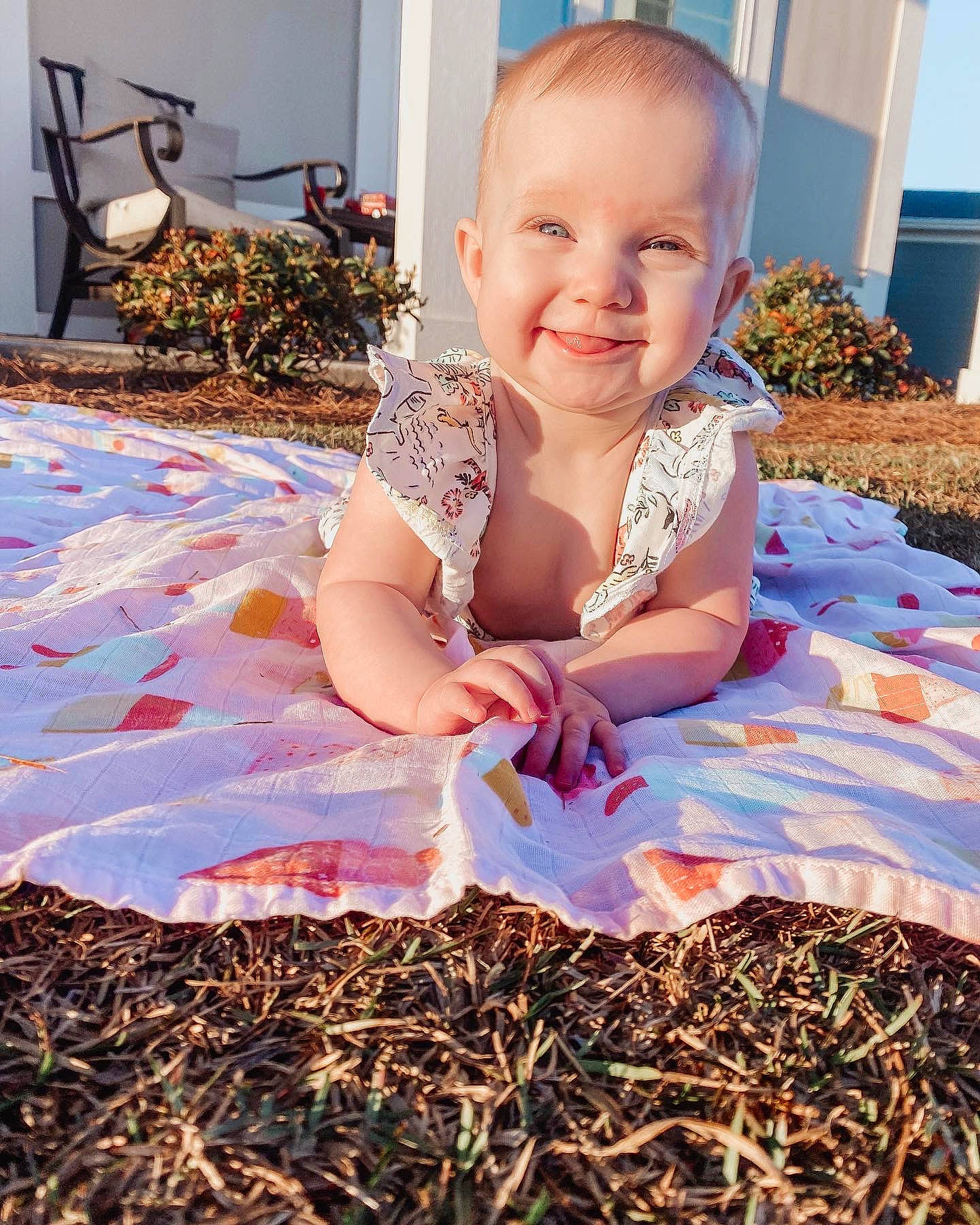 Everly is registered to the contest to win money with this photo: baby, baby_toddler_clothing, child, dress, flooring, fun, garden, grass, happy, houseplant, joy, magenta, pattern, people_in_nature, person, plant, play, sitting, smile, soil