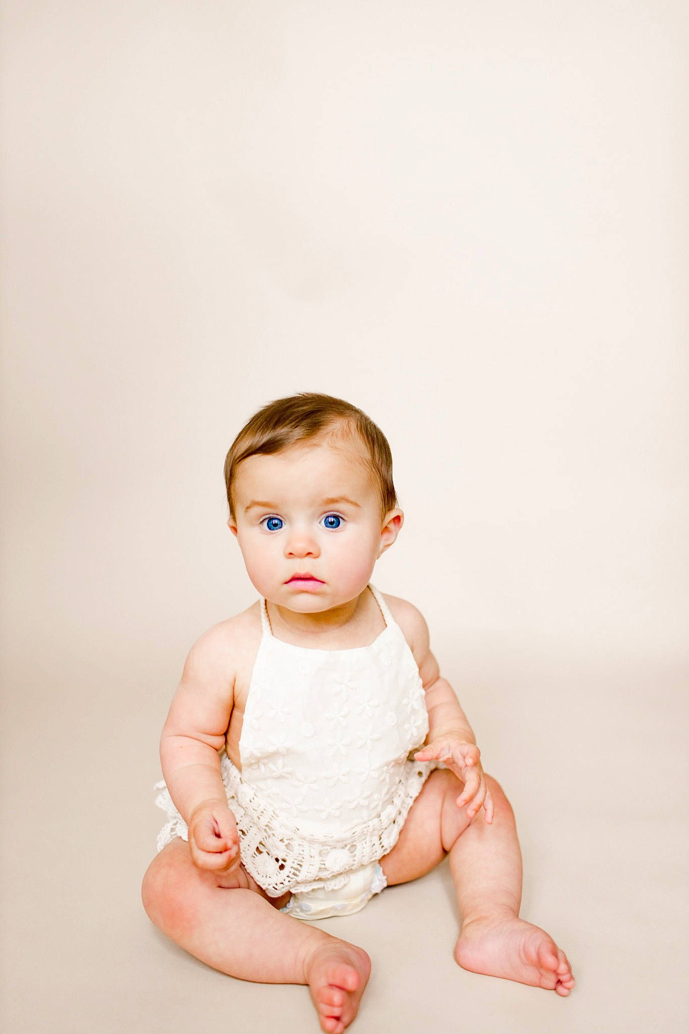 Aubrey Bell Martin is registered to the contest to win money with this photo: baby, baby_toddler_clothing, barefoot, cheek, collar, dress, eye, flash_photography, foot, gesture, happy, head, human_body, human_leg, iris, leg, person, sitting, skin, sleeve