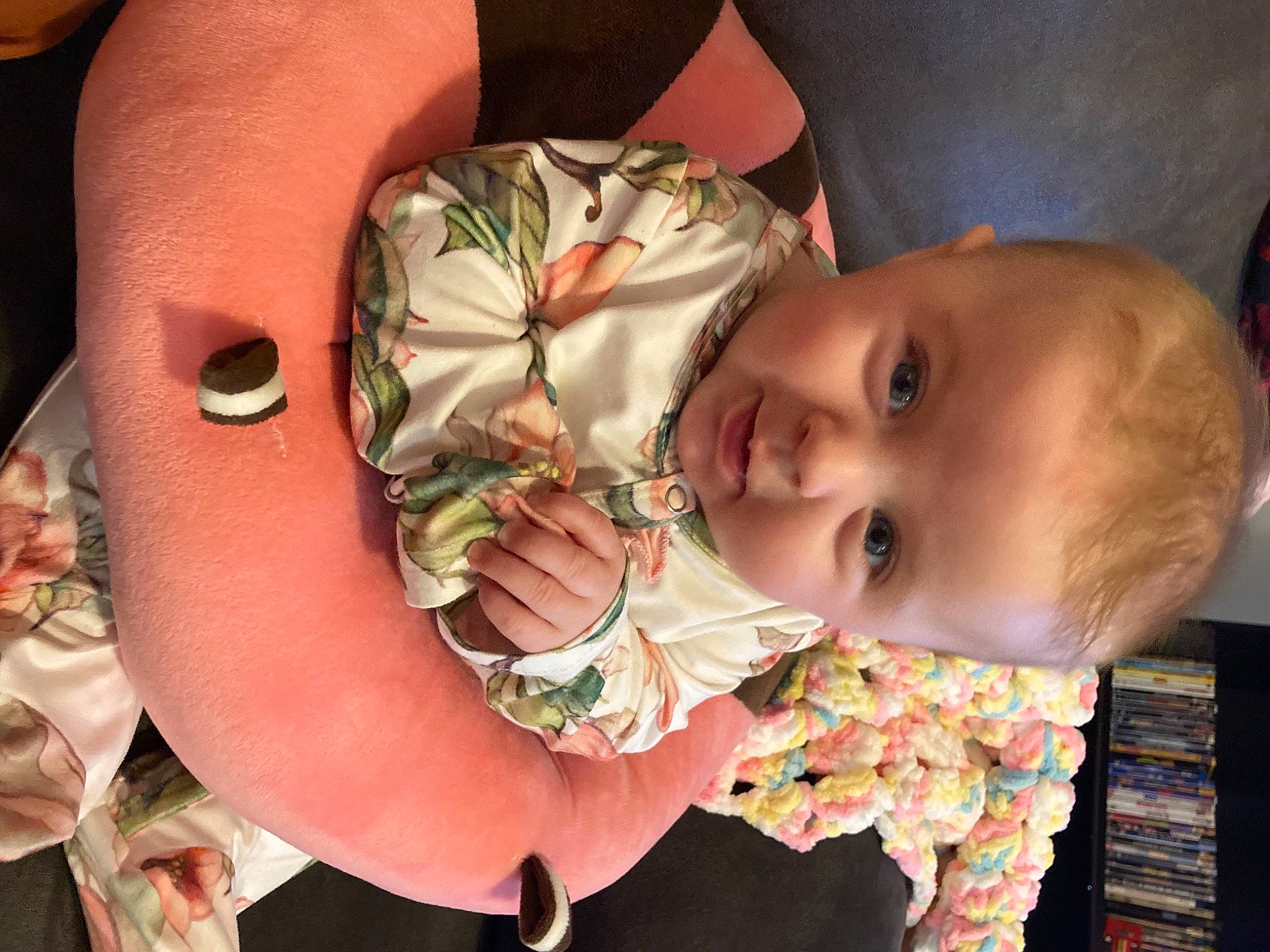 Koraline is registered to the contest to win money with this photo: baby, baby_products, baby_toddler_clothing, bookcase, cheek, child, peach, person, shelf, toddler