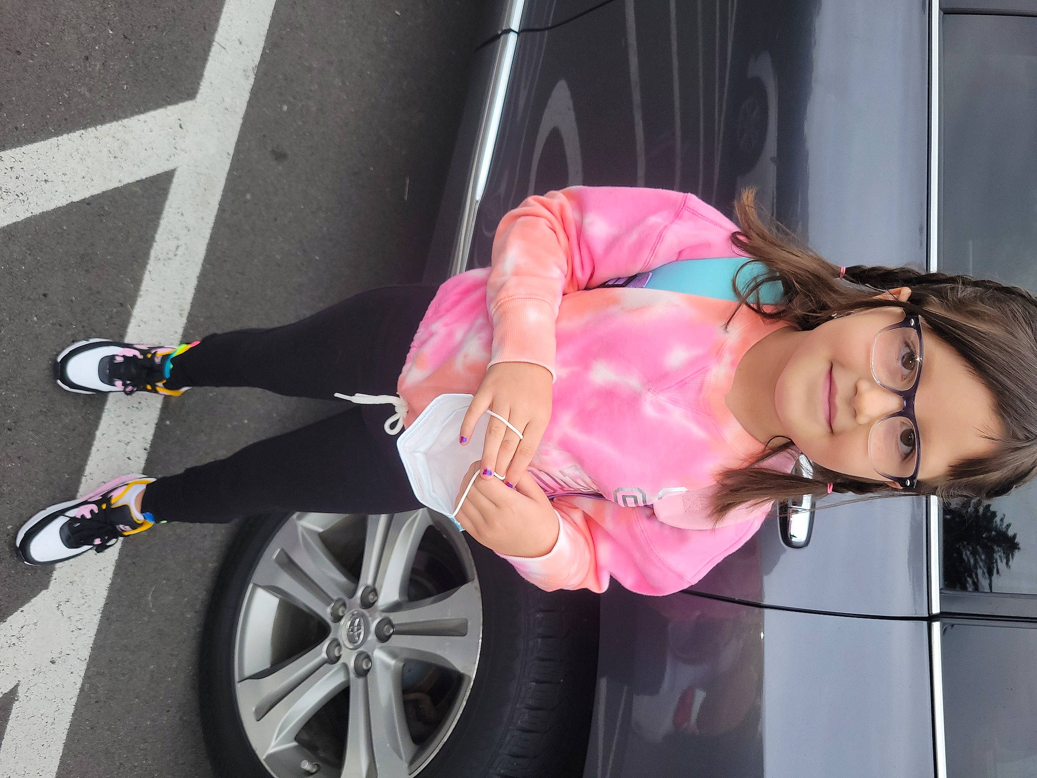 Haylee is registered to the contest to win money with this photo: alloy_wheel, arm, automotive_design, automotive_exterior, automotive_tire, car, dress, fender, glasses, hand, joy, leg, motor_vehicle, person, rim, smile, street_fashion, thigh, tire, vehicle