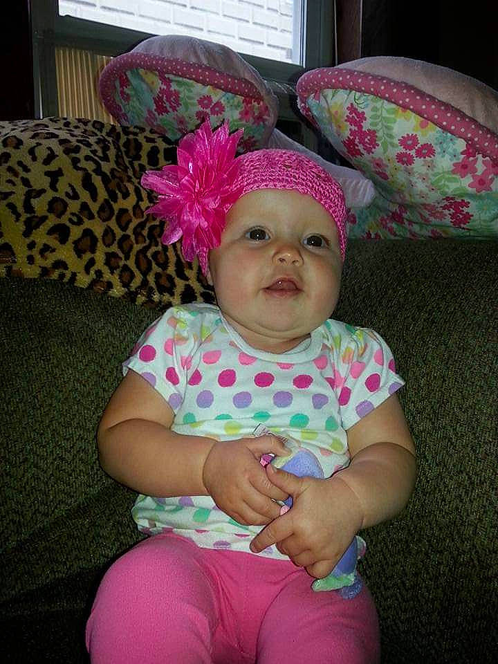 Haylee is registered to the contest to win money with this photo: baby, baby_toddler_clothing, cap, child, comfort, costume_hat, fashion_accessory, hair_accessory, happy, head, headpiece, headwear, magenta, party_supply, pattern, person, pink, purple, sitting, sleeve