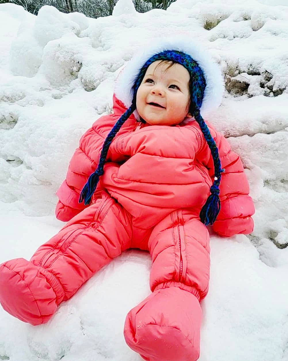 Ryleigh is registered to the contest to win money with this photo: baby, baby_toddler_clothing, cap, cheek, face, freezing, fun, fur, happy, head, headwear, parka, people_in_nature, person, playing_in_the_snow, playing_with_kids, recreation, smile, snow, toddler