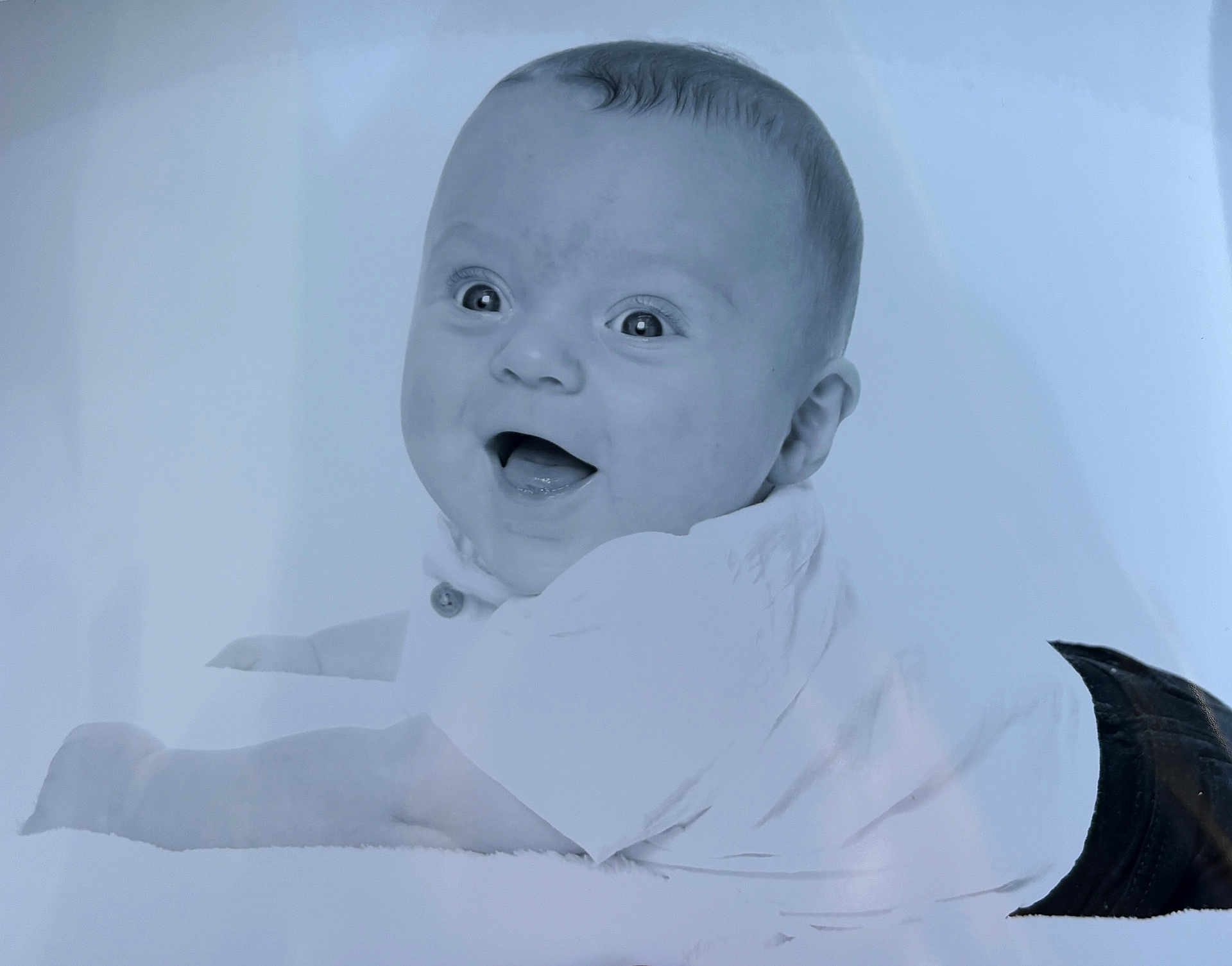 Enzo joined the competition — help win amazing prizes! baby, infant, smile, happy, face, eyes, clothing, shirt, pants, lying_down, portrait, monochrome, child, cute, young, person, head, expression, background, studio