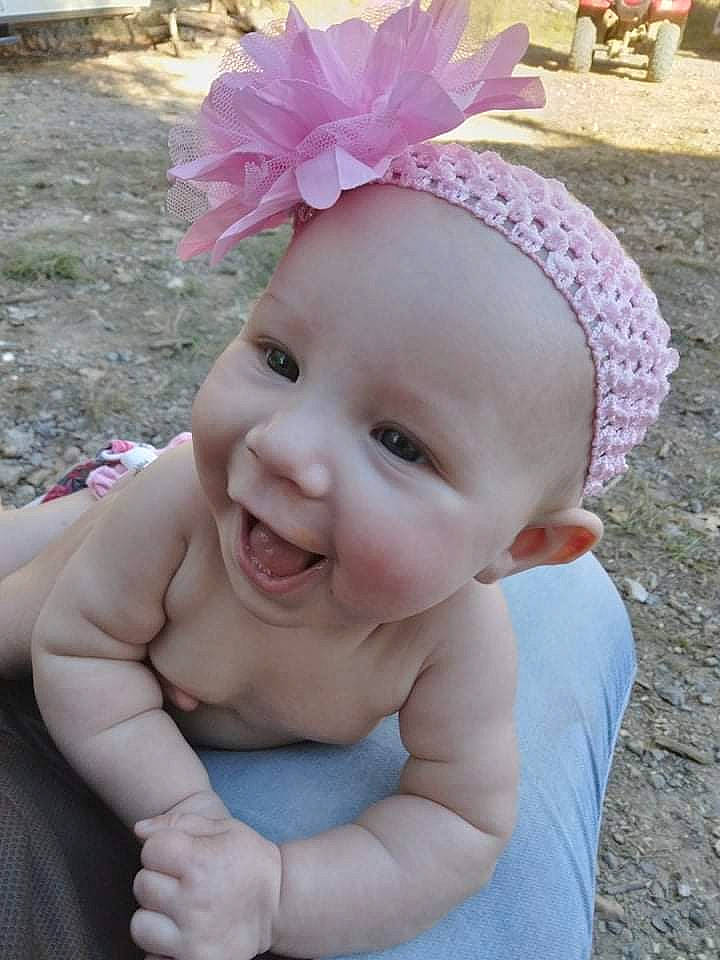 Brylee joined the competition — help win amazing prizes! baby, baby_laughing, baby_toddler_clothing, cap, cool, face, fun, grass, green, happy, head, headgear, magenta, person, petal, pink, plant, purple, skin, smile
