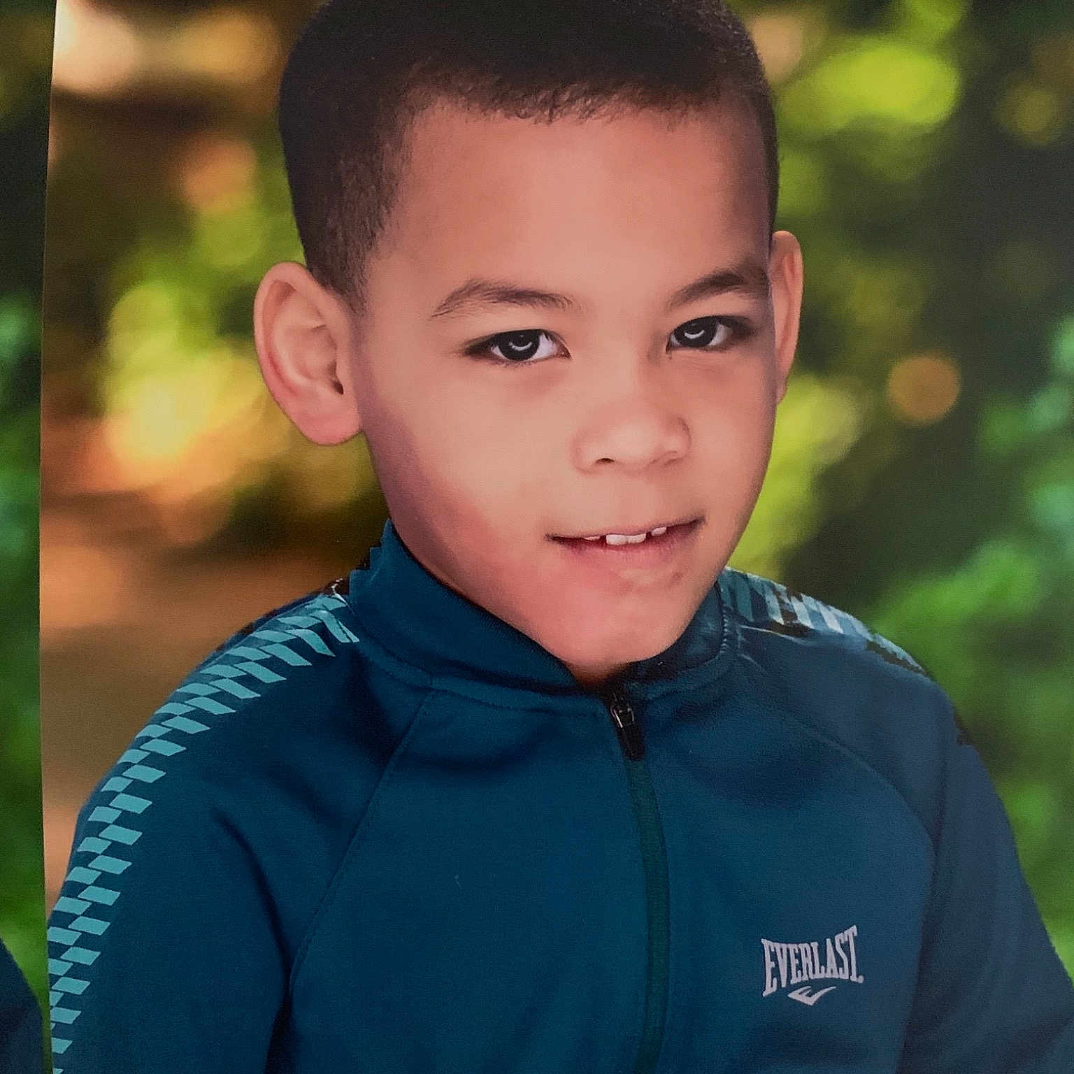 Josue is registered to the contest to win money with this photo: cheek, child, child_model, chin, eye, face, flash_photography, forehead, green, happy, head, male, people, person, photography, portrait, portrait_photography, smile, toddler, tree