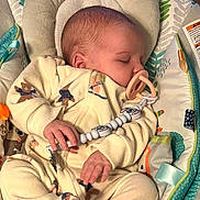 Nayeli joined the competition — help win amazing prizes! baby, sleeping, pacifier, baby_seat, onesie, hand, infant, child, blanket, soft_toys, pattern, comfort, cute, peaceful, indoors, fabric, rest, young_child, clothing, relaxation