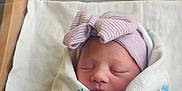 Izzybella joined the competition — help win amazing prizes! baby, bassinet, blanket, bow, child, cozy, cute, face, hat, hospital, indoor, infant, newborn, peaceful, person, resting, sleeping, soft_light, striped, wrapped