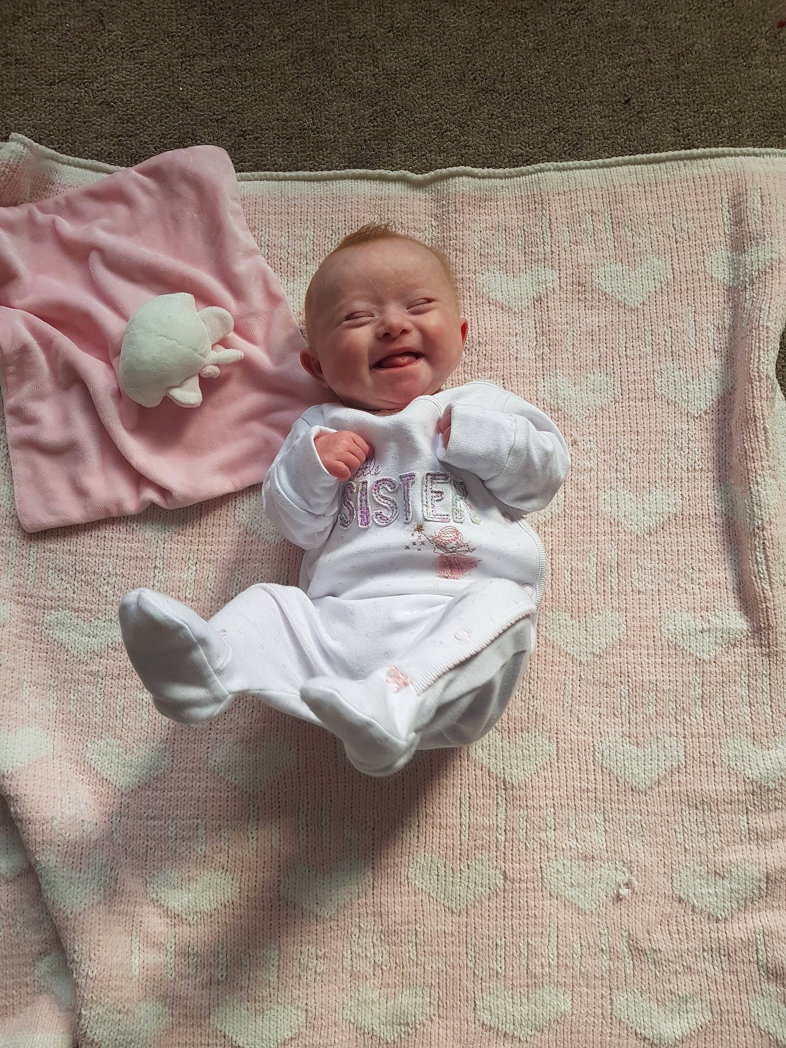 Maisie is registered to the contest to win money with this photo: baby, baby_products, baby_sleeping, baby_toddler_clothing, child, comfort, linens, person, product, sleep, smile, textile, toddler