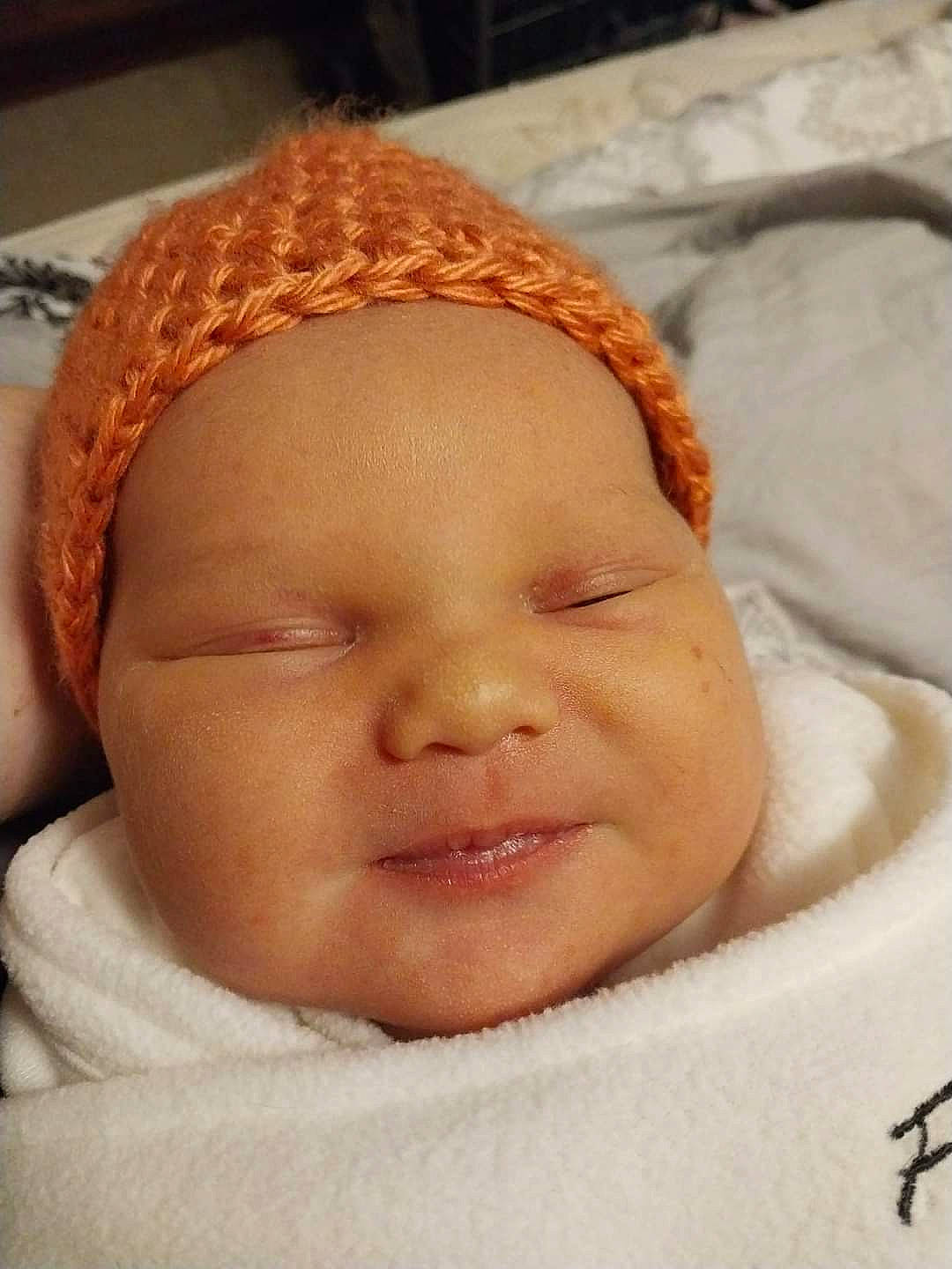 Leah is registered to the contest to win money with this photo: baby, baby_sleeping, cap, cheek, child, chin, close_up, comfort, ear, eye, eyebrow, forehead, happy, head, headgear, headwear, lip, nose, person, skin