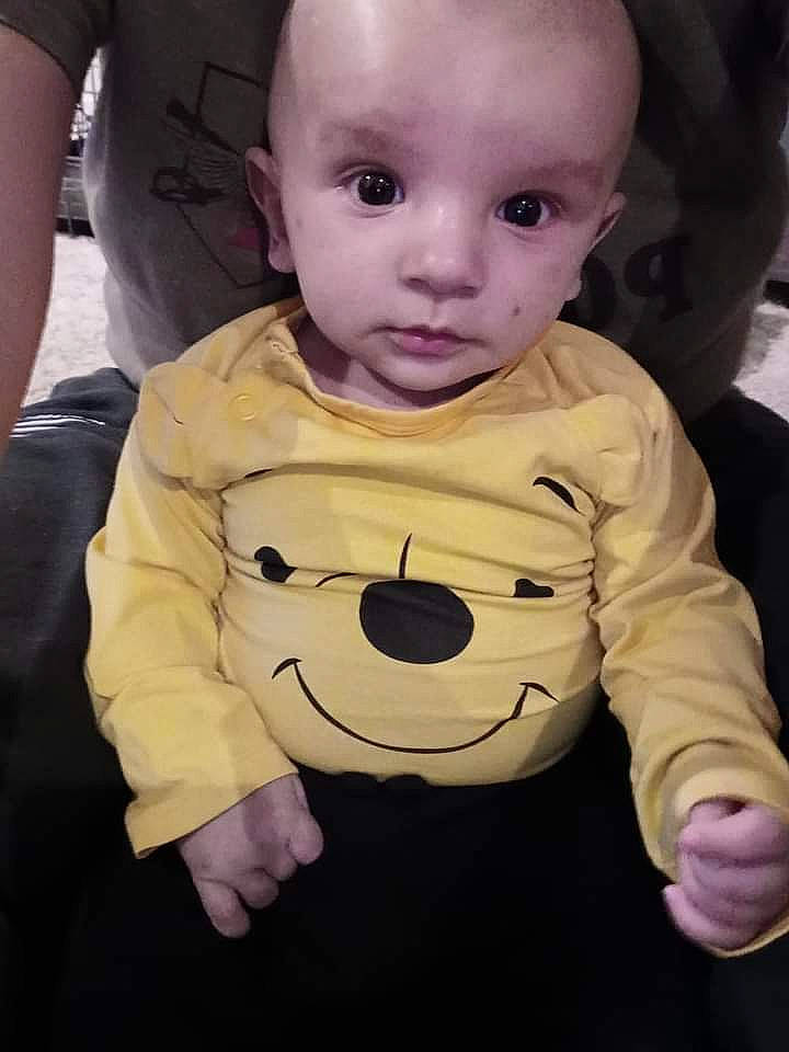 Drew is registered to the contest to win money with this photo: baby, baby_toddler_clothing, cheek, child, cool, eyelash, facial_expression, fun, gesture, hairstyle, happy, head, human, mouth, nose, person, pink, sleeve, standing, t_shirt