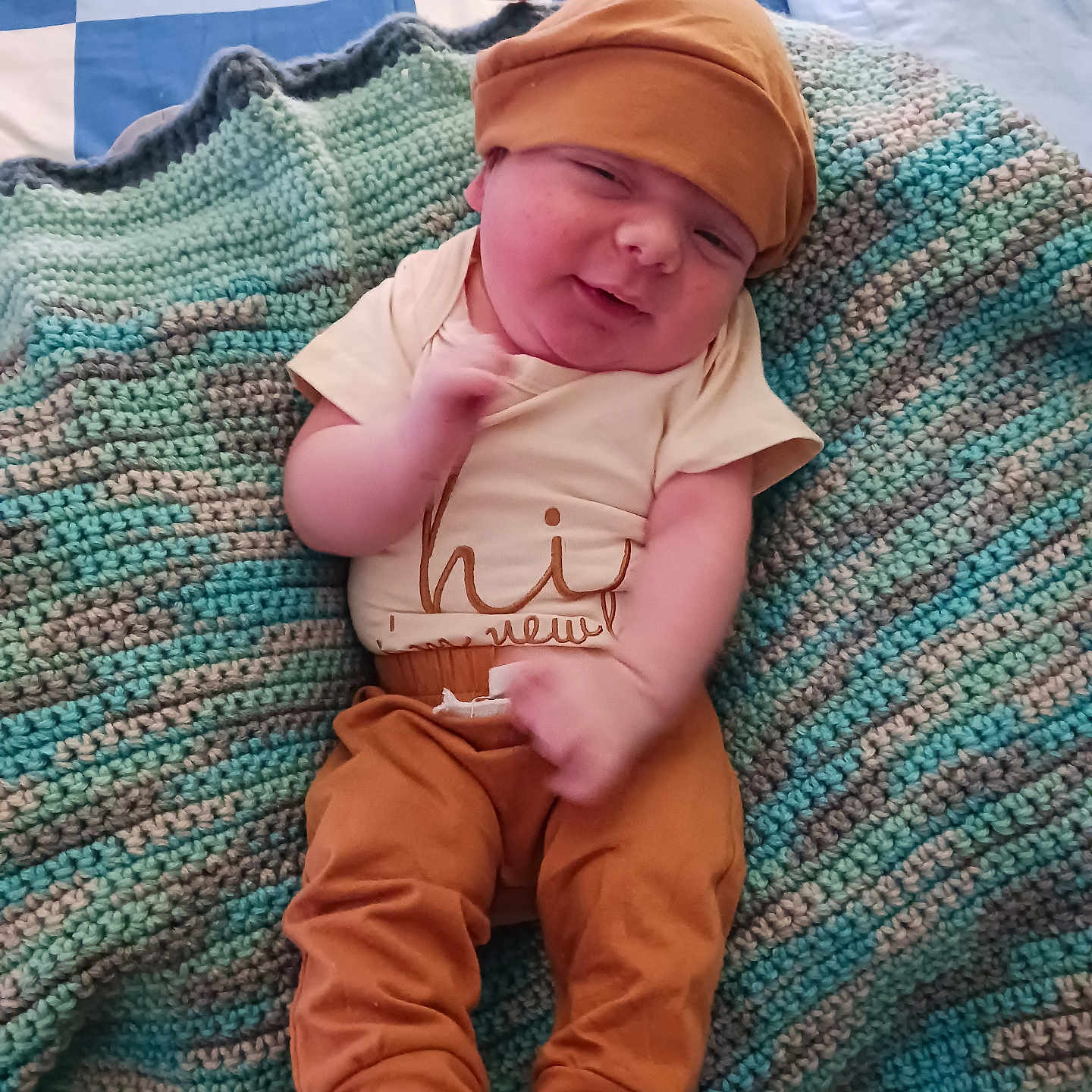 Alexander Jr is registered to the contest to win money with this photo: baby, bed, blanket, child, clothing, crochet, cute, fabric, face, feet, hand, hat, home, infant, lying_down, person, relax, smile, soft, warm