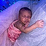 Kalyapea is registered to the contest to win money with this photo: baby, close_up, cute, delicate, fabric, face, fairy_lights, hand, infant, newborn, peaceful, pink, portrait, resting, serene, skin, sleeping, soft_lighting, tulle, wrapped