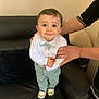 Badis a rejoint le concours — aidez-le/la à gagner de superbes lots ! adult, baby, bow_tie, boy, child, clothing, couch, face, furniture, hands, home, indoor, leather, pants, person, shirt, shoes, smile, support, toddler