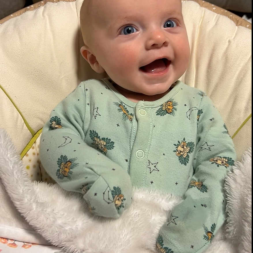 Isabella joined the competition — help win amazing prizes! baby, bed, blanket, bodypart, couch, cushion, face, finger, furniture, hand, happy, head, homedecor, newborn, person, photography, portrait, quilt, sitting, smile