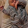 Timaé participe au concours pour gagner de l'argent avec cette photo : baby, sleeping, onesie, gray_stripes, cushion, blanket, indoor, peaceful, infant, child, resting, soft, cozy, portrait, person, cute, comfortable, nap, toddler, homedecor
