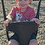 Sebastian joined the competition — help win amazing prizes! child, swing, playground, red_cap, smiling, toddler, shorts, cartoon_tshirt, footwear, outdoor, sunlight, happy, face, legs, hands, black_swing, gravel, daytime, recreation, park