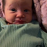 Wrenn joined the competition — help win amazing prizes! baby, infant, face, eyes, clothing, green_outfit, polka_dots, blanket, pink_blanket, soft_texture, close_up, portrait, cute, newborn, skin, expression, indoors, cozy, child, person