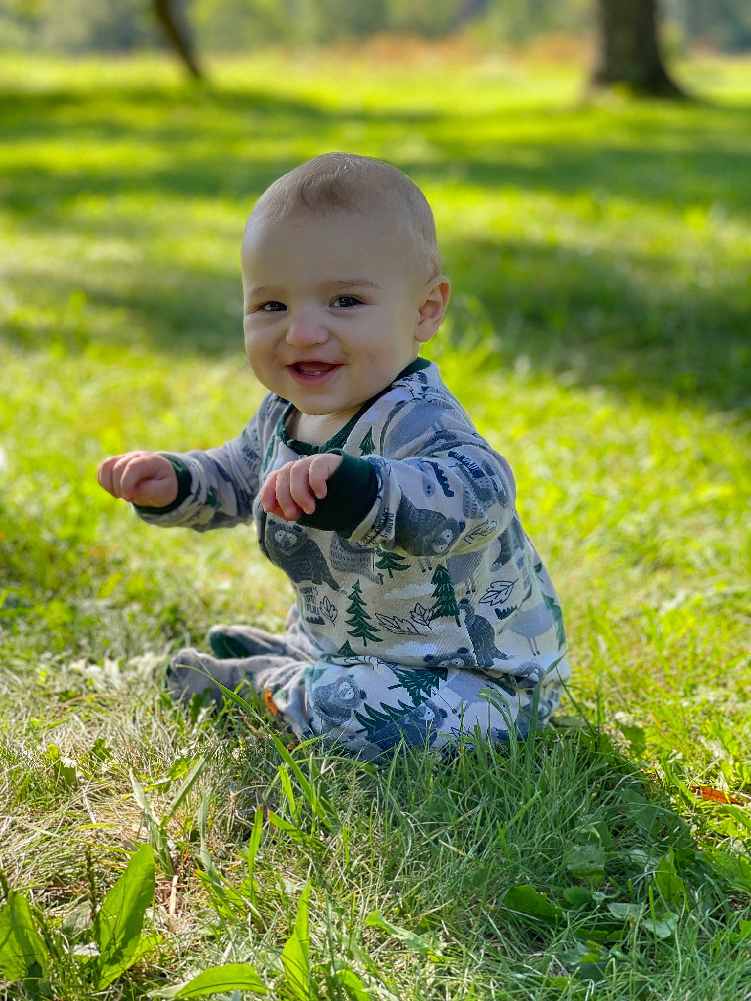 Mason is registered to the contest to win money with this photo: baby, baby_toddler_clothing, child, eye, fun, grass, grassland, groundcover, happy, joy, landscape, lawn, leaf, meadow, natural_landscape, people_in_nature, person, plant, prairie, smile