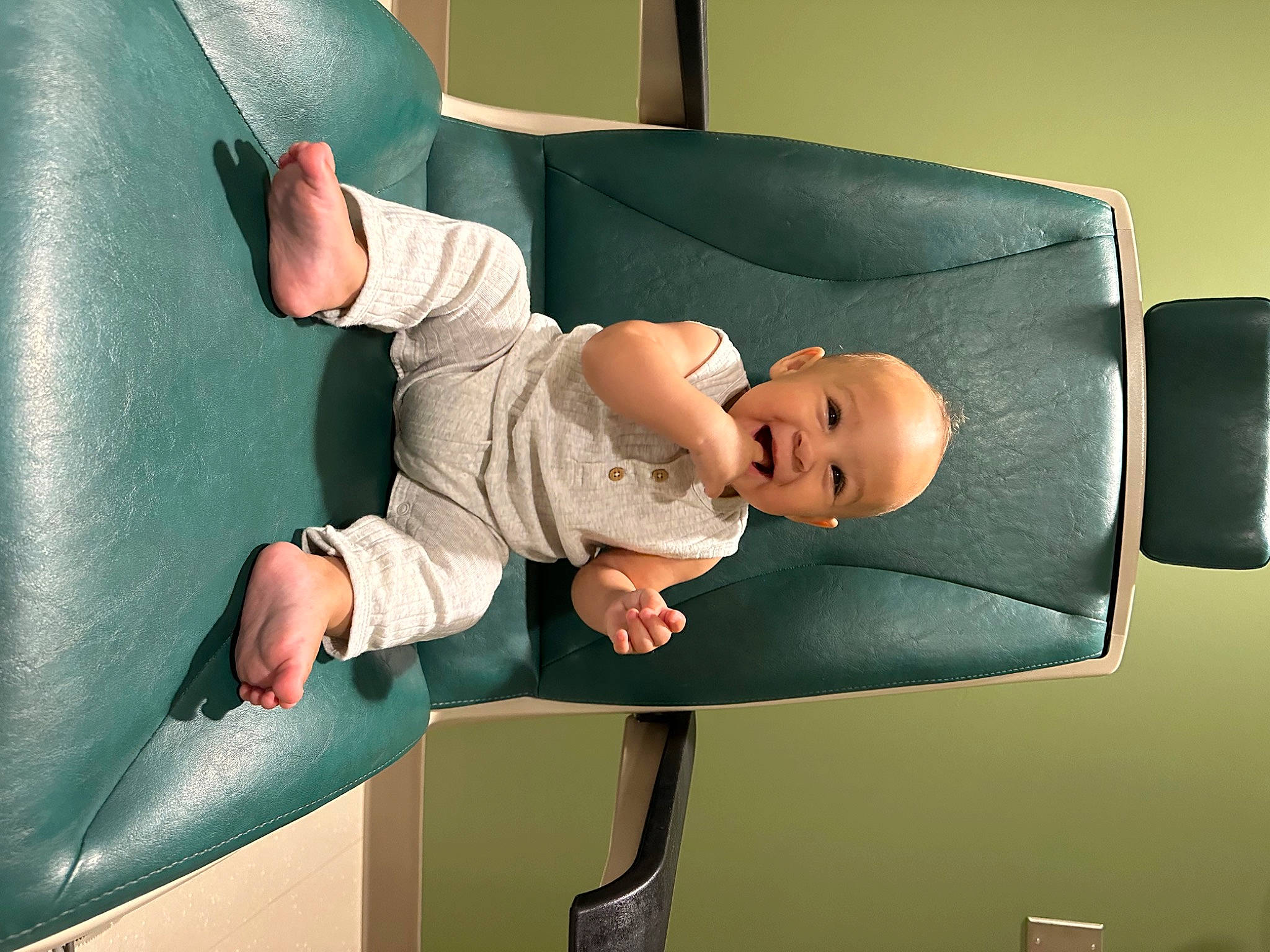 Cassius is registered to the contest to win money with this photo: baby, baby_products, baby_safety, baby_toddler_clothing, child, comfort, elbow, hat, knee, leisure, linens, person, room, sitting, sleeve, t_shirt, toddler