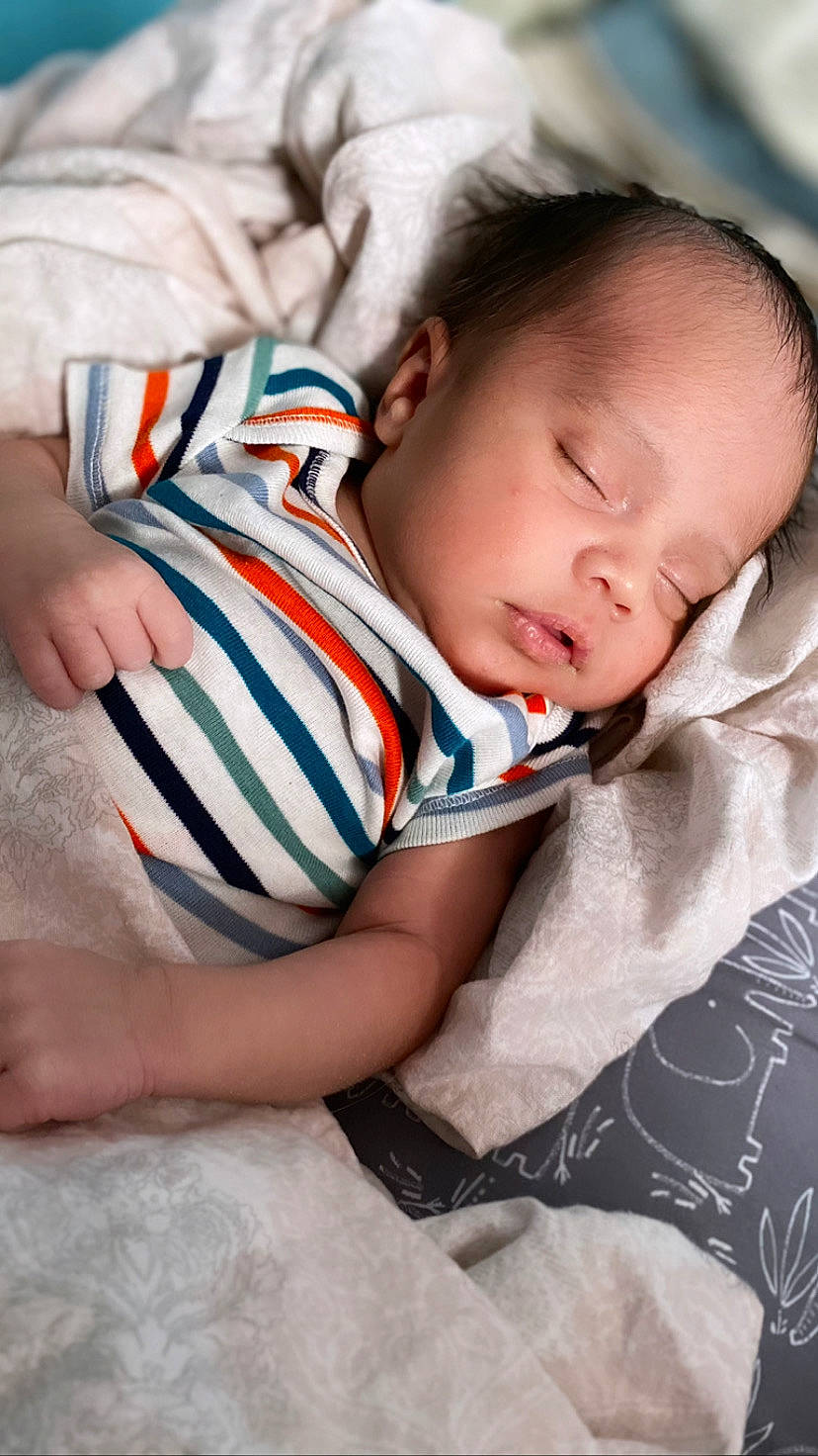 Zaine joined the competition — help win amazing prizes! baby, baby_sleeping, baby_toddler_clothing, bedtime, child, close_up, comfort, elbow, finger, grass, happy, human_leg, knee, linens, mouth, nose, person, sitting, skin, thigh