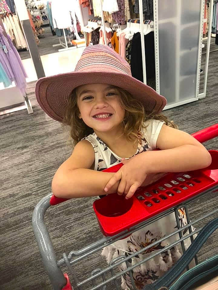 Jolee is registered to the contest to win money with this photo: automotive_design, automotive_lighting, automotive_tire, brown_hair, bumper, eyewear, fun, happy, hat, headgear, headwear, hood, human_leg, joy, long_hair, magenta, motor_vehicle, person, pink, smile