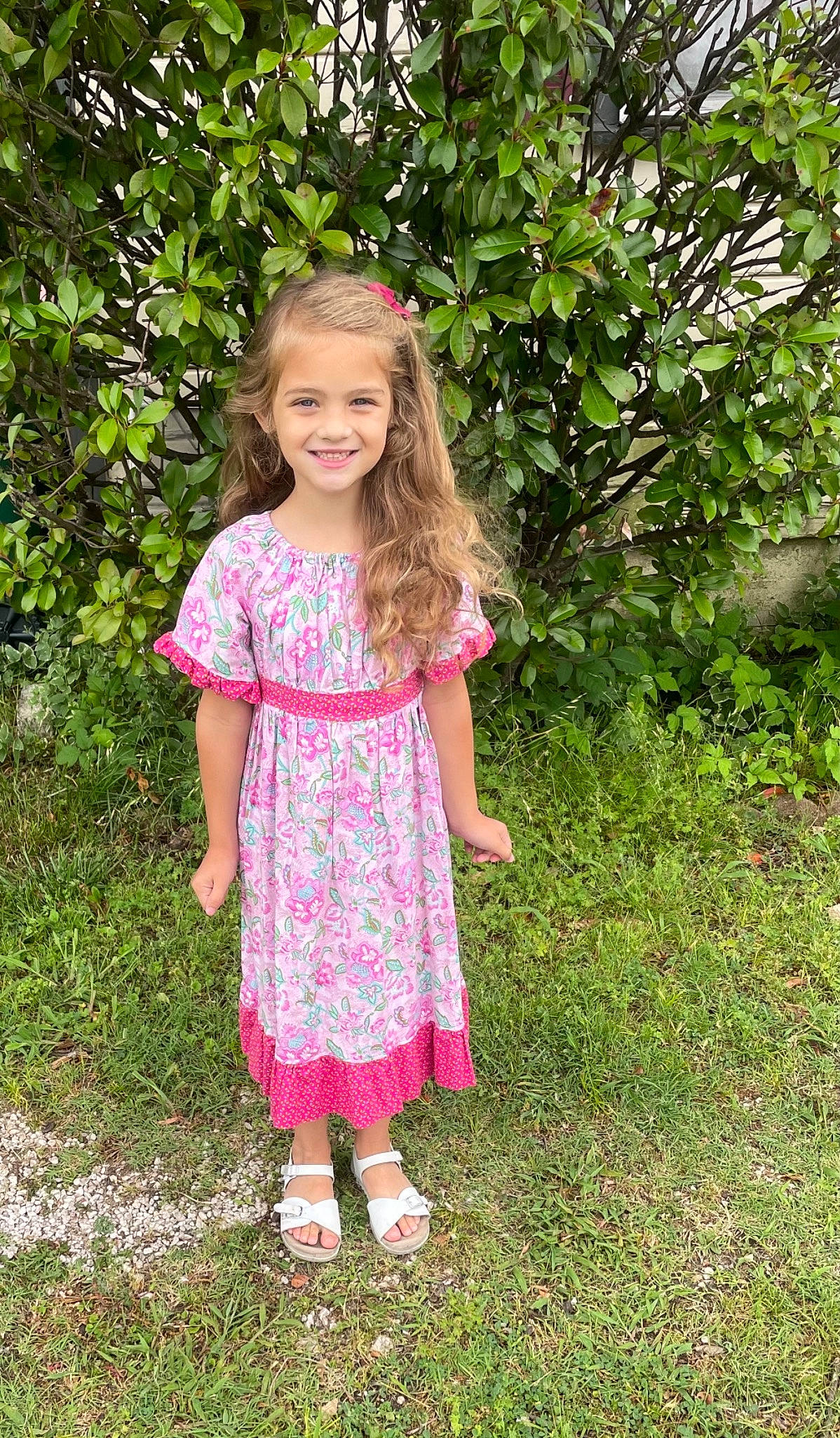 Jolee is registered to the contest to win money with this photo: baby_toddler_clothing, day_dress, dress, grass, grass_family, hair, hairstyle, happy, joy, leaf, magenta, one_piece_garment, people_in_nature, person, pink, plant, shrub, sleeve, smile, standing