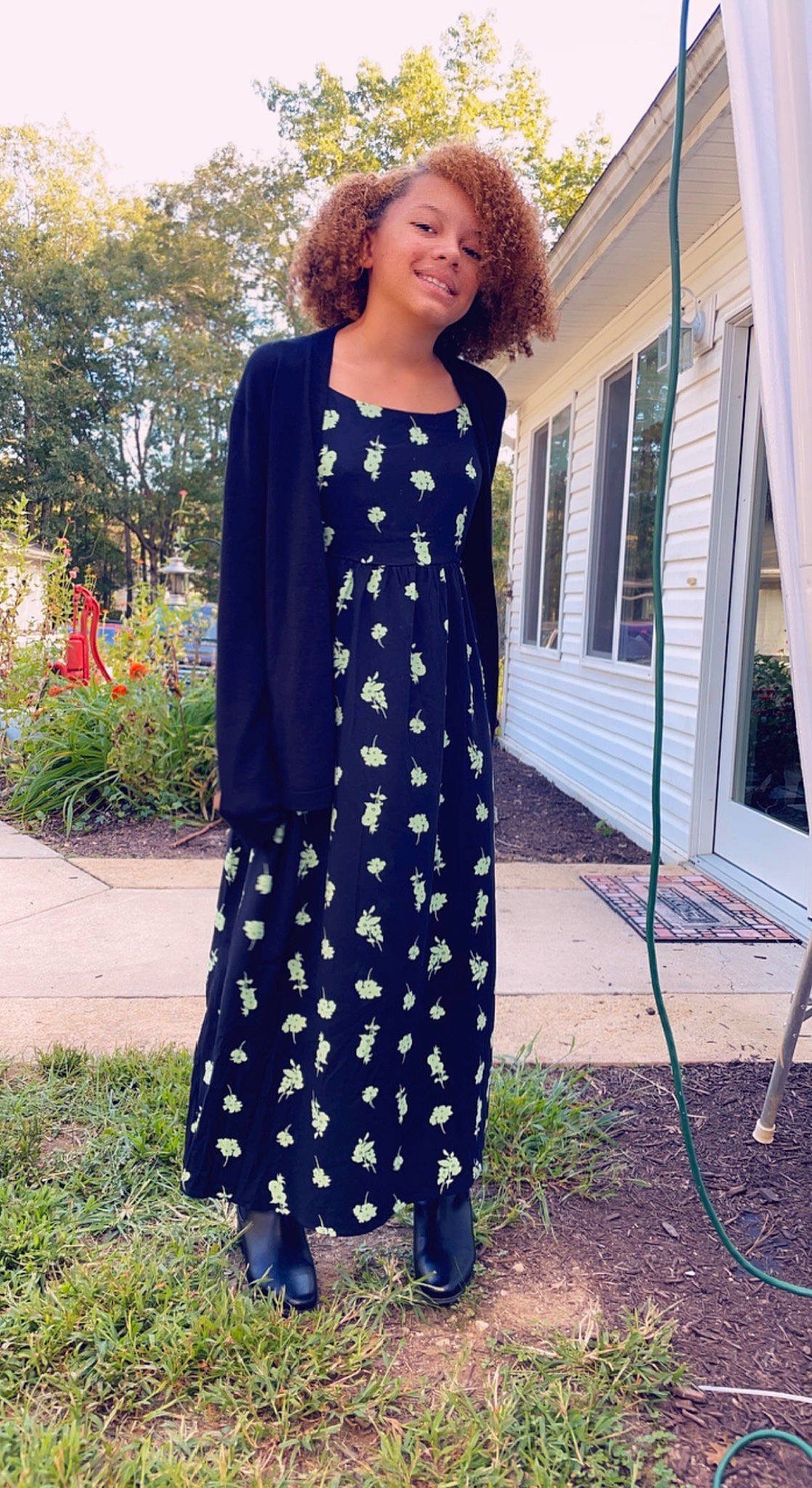 Allyssa is registered to the contest to win money with this photo: day_dress, dress, electric_blue, fashion, footwear, formal_wear, grass, joy, long_hair, neck, one_piece_garment, outerwear, pattern, person, plant, sleeve, smile, standing, summer, textile