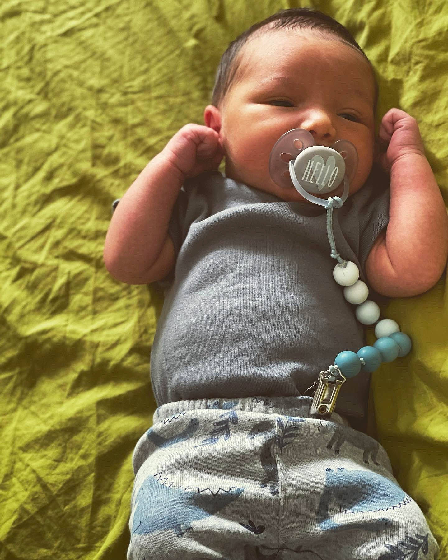 Oliver joined the competition — help win amazing prizes! arm, baby, baby_toddler_clothing, cheek, comfort, eye, face, facial_expression, finger, gesture, grass, hand, head, human_body, lip, mammal, mouth, nose, person, skin