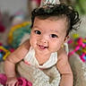 baby, party_hat, blanket, smiling, curly_hair, toy, colorful, indoor, closeup, infant, happy, cute, child, portrait, pink, white, soft_texture, celebration, young, person