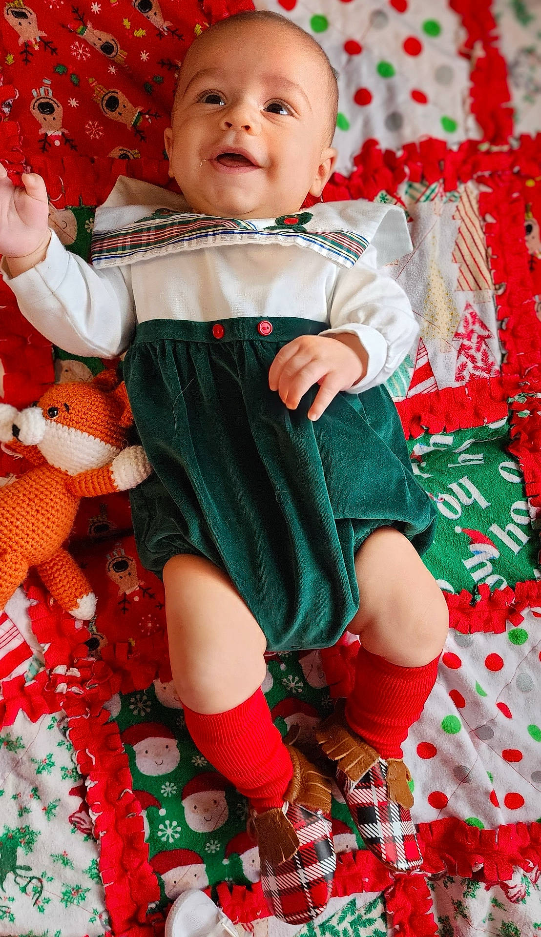 applique, baby, bodypart, clothing, costume, dress, face, finger, furniture, hand, head, hosiery, pants, person, photography, portrait, shorts, sitting, sock, toy