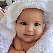 Alehandra participe au concours pour gagner de l'argent avec cette photo : baby, infant, smile, towel, white_towel, wrapped, cute, face, skin, hand, blue_eyes, indoors, portrait, child, soft_texture, newborn, happy, closeup, adorable, cozy