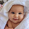baby, infant, smile, towel, white_towel, wrapped, cute, face, skin, hand, blue_eyes, indoors, portrait, child, soft_texture, newborn, happy, closeup, adorable, cozy