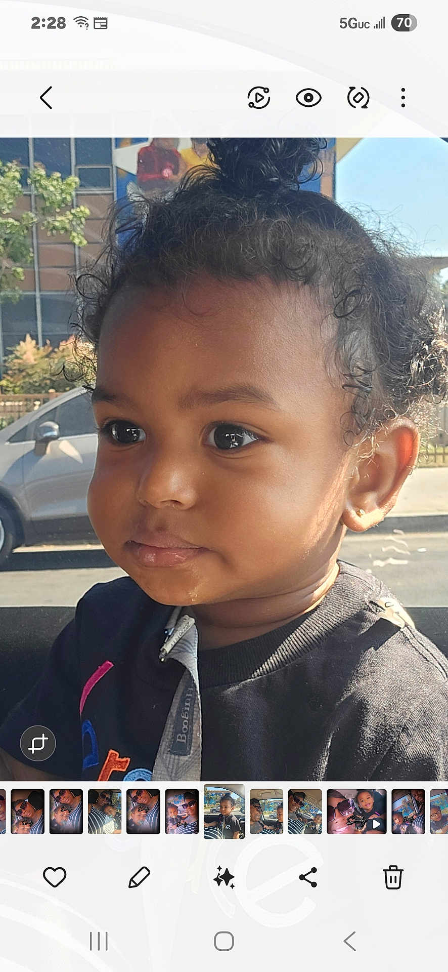 Legend joined the competition — help win amazing prizes! toddler, child, curly_hair, face, portrait, car_interior, sunlight, black_shirt, young_child, close_up, big_eyes, expression, indoors, seat, window, daylight, cute, person, skin, hair_tied