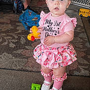 Ashlee joined the competition — help win amazing prizes! adult, baby, bow, carpet, casual, child, curious, expression, floor, footwear, girl, home, indoor, pink_clothing, plaything, room, seated_person, socks, standing, toy