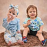 baby, bow, boy, child, clothing, cute, girl, happy, headband, indoor, pacifier, portrait, rug, shoes, siblings, sitting, smile, studio, toddler, waving