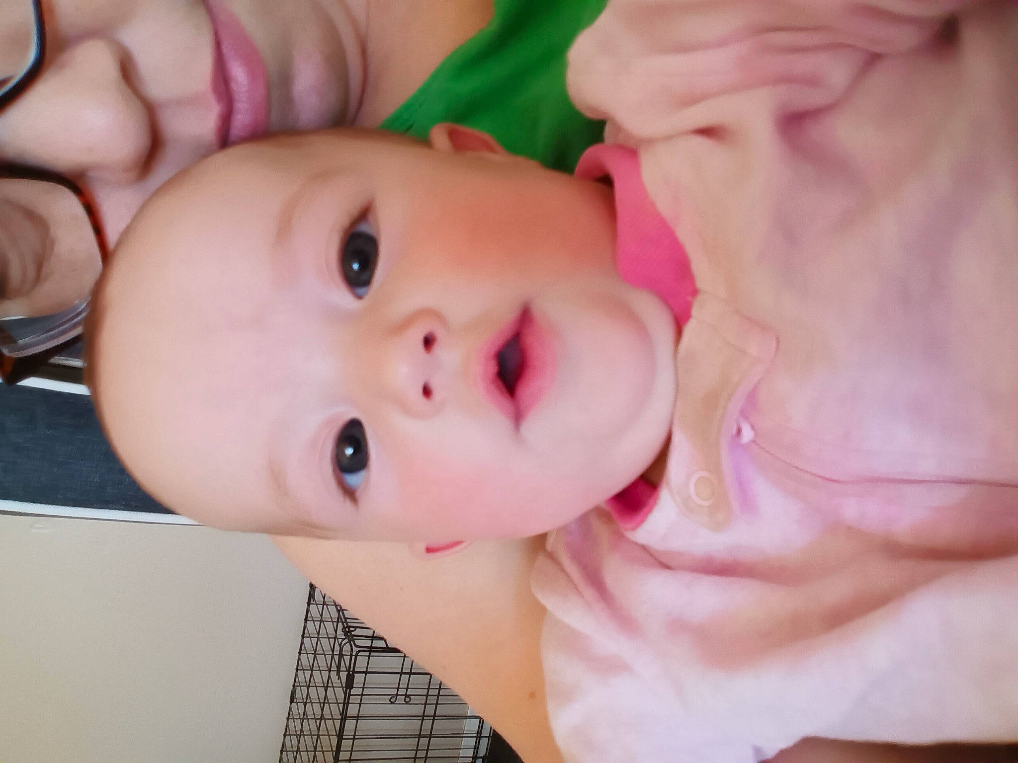 Raina is registered to the contest to win money with this photo: baby, baby_toddler_clothing, cheek, chest, chin, ear, eyebrow, eyelash, fun, gesture, happy, human_body, iris, lip, mouth, neck, nose, person, pink, skin