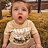 Quinn joined the competition — help win amazing prizes! toddler, child, grass, outdoor, curly_hair, yellow_shirt, pants, expression, surprised, sky, clouds, tree, park, daylight, person, young_child, sitting, casual_clothing, nature, cute