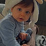 baby, infant, child, blue_eyes, plush_hat, bunny_hat, onesie, pacifier, baby_seat, stroller, hands, blanket, indoor, kitchen, countertop, toy, portrait, close_up, cute, curious_gaze