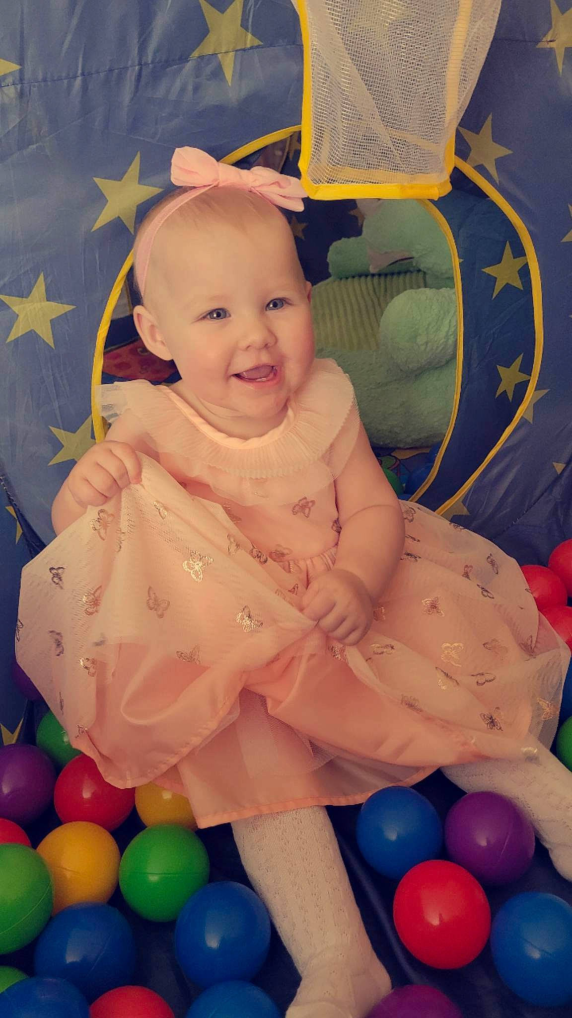 Novalee is registered to the contest to win money with this photo: baby, baby_products, baby_toddler_clothing, ball_pit, beauty, blue, cheek, child, event, fun, happy, iris, joy, person, play, room, sitting, smile, toddler, toy