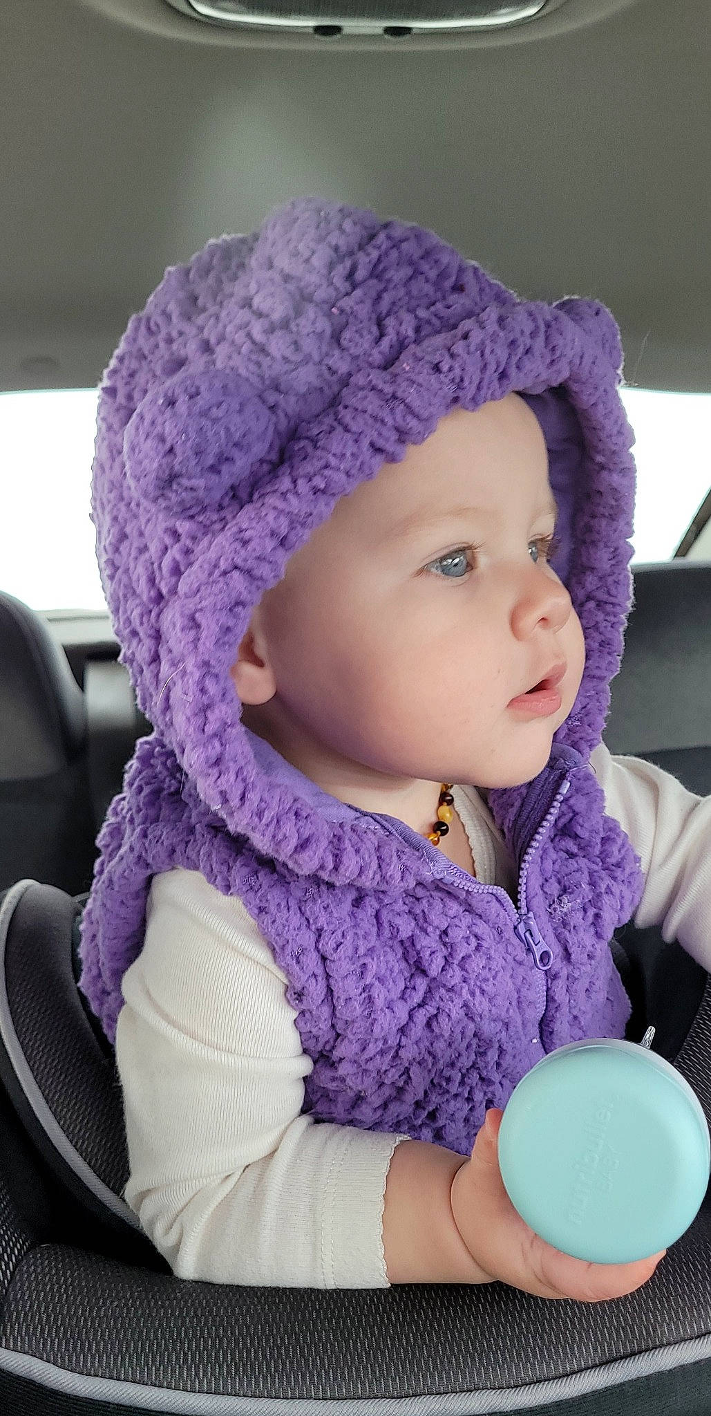 Novalee joined the competition — help win amazing prizes! baby, baby_toddler_clothing, beauty, cap, cheek, child, electric_blue, headgear, headwear, jacket, knit_cap, magenta, outerwear, person, pink, product, purple, textile, toddler, violet