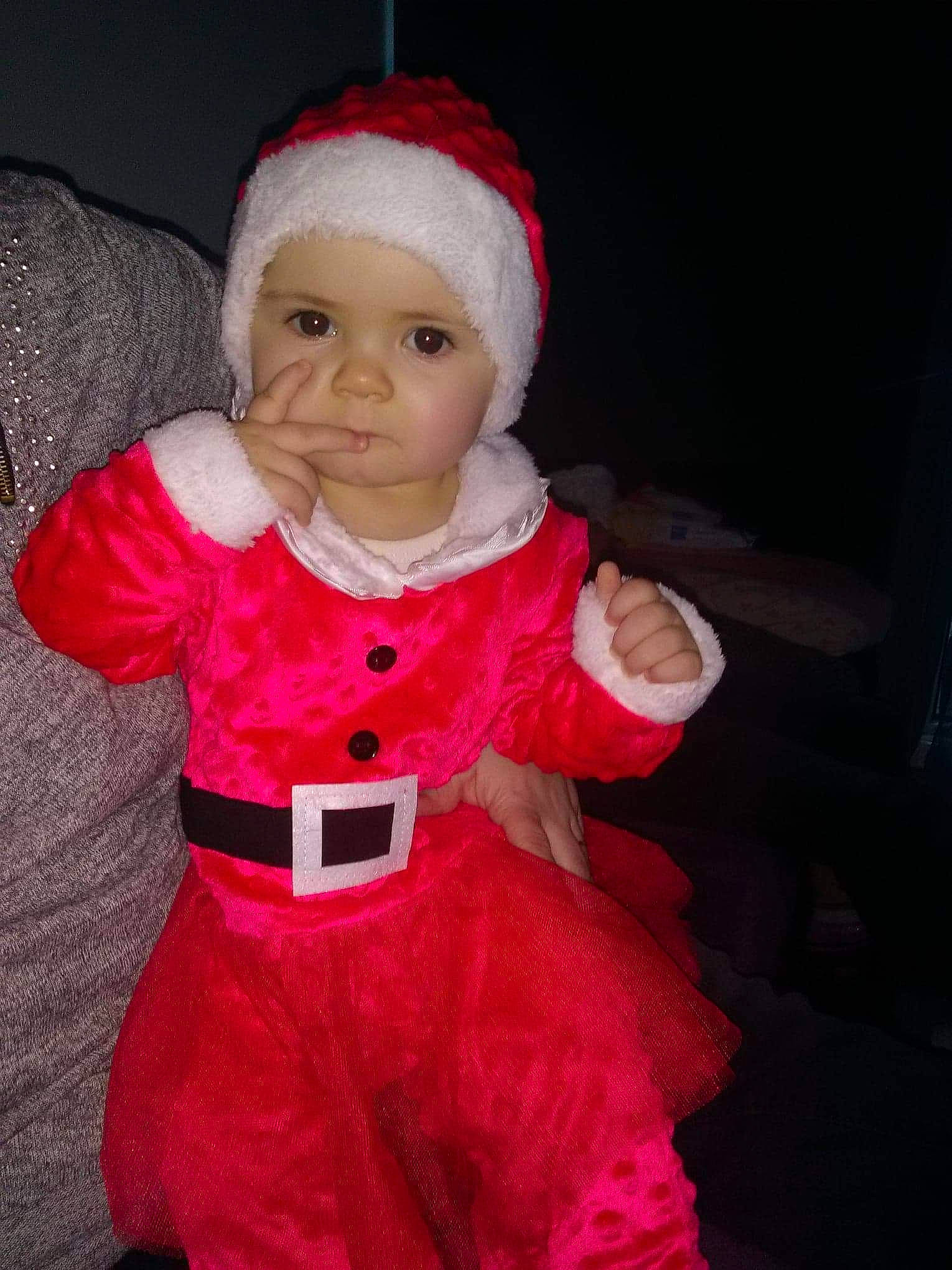 Rachel participe au concours pour gagner de l'argent avec cette photo : child, christmas, costume, doll, headgear, holiday, infant, person, pink, red, santa_claus, skin, smile, textile, toddler