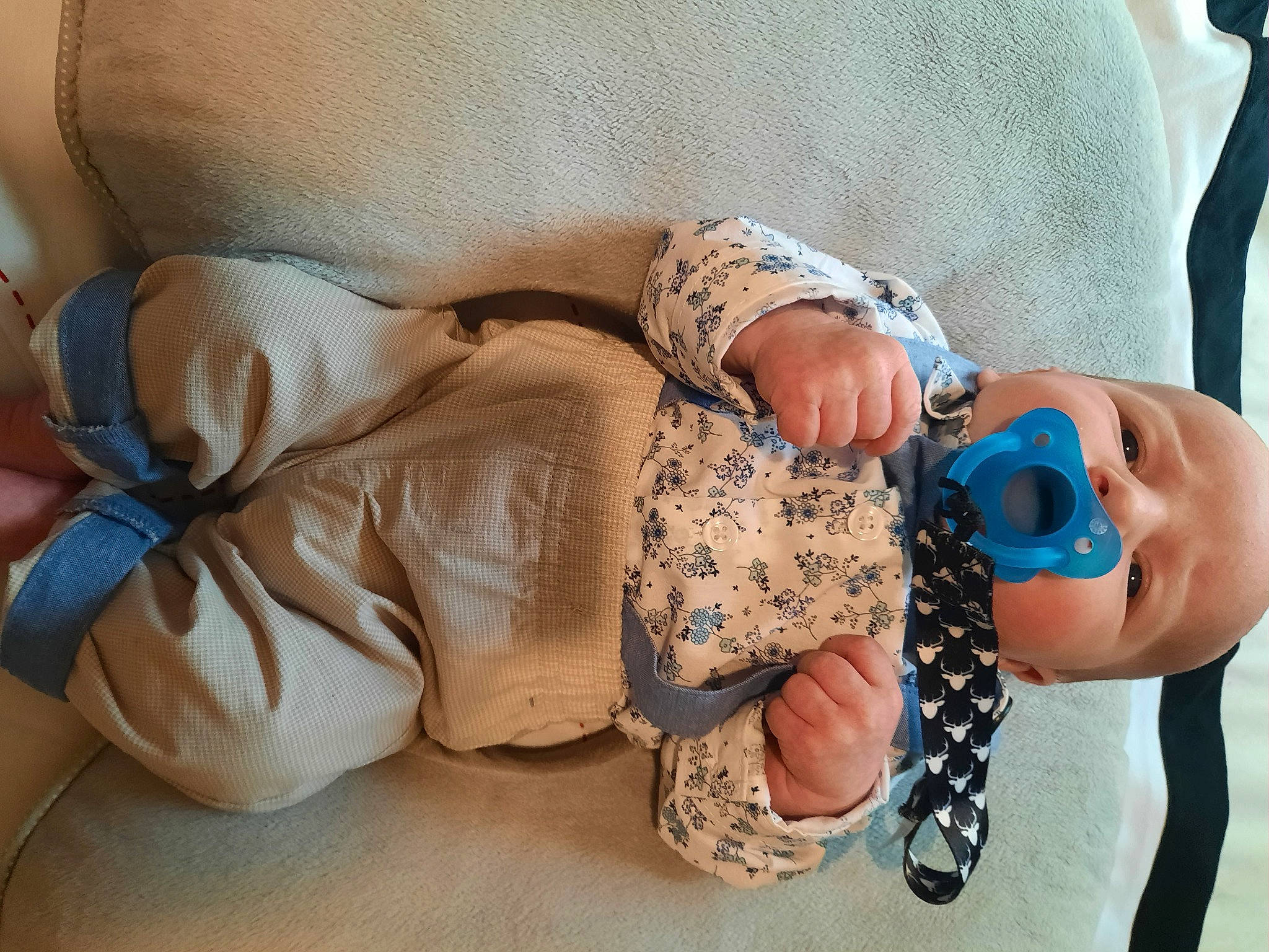 Edgar is registered to the contest to win money with this photo: abdomen, baby, baby_sleeping, baby_toddler_clothing, comfort, finger, gesture, hand, human_leg, knee, linens, nail, pattern, person, skin, sleeve, textile, thigh, thumb, toddler