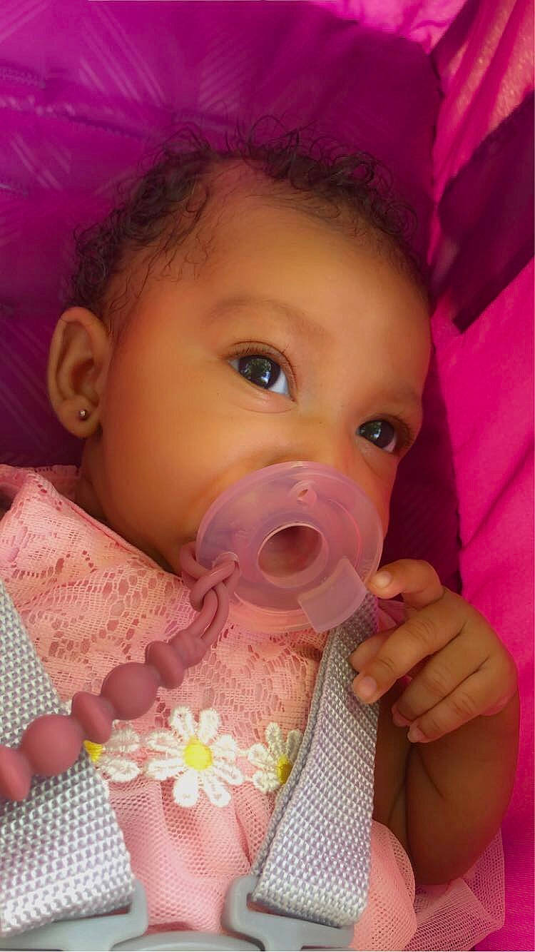 Jaliyah joined the competition — help win amazing prizes! baby, baby_toddler_clothing, cheek, chin, drinkware, ear, eyebrow, eyelash, facial_expression, finger, head, iris, lip, mouth, nose, organ, person, pink, skin, tableware