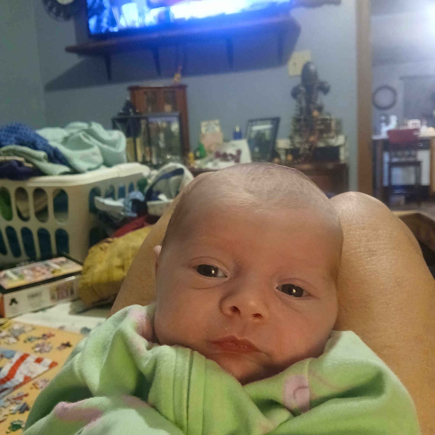 Rosa'Lli Benoit joined the competition — help win amazing prizes! baby, blanket, blanket_pattern, clothing, couch, decor, eyes, face, furniture, green, home_interior, infant, laundry_basket, legs, living_room, person, pink, relaxing, table, television