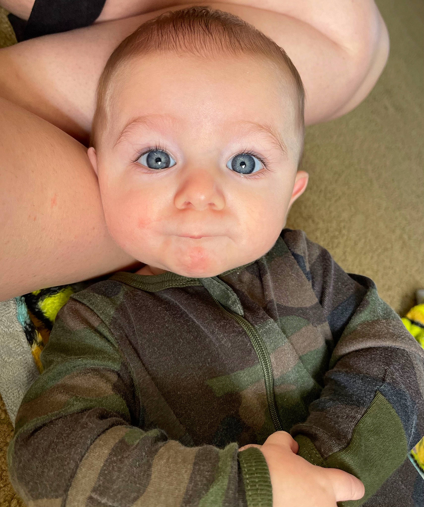 Halen is registered to the contest to win money with this photo: arm, baby, baby_toddler_clothing, cheek, comfort, ear, eye, eyelash, finger, gesture, hand, human_body, iris, lip, mouth, neck, nose, person, skin, sleeve