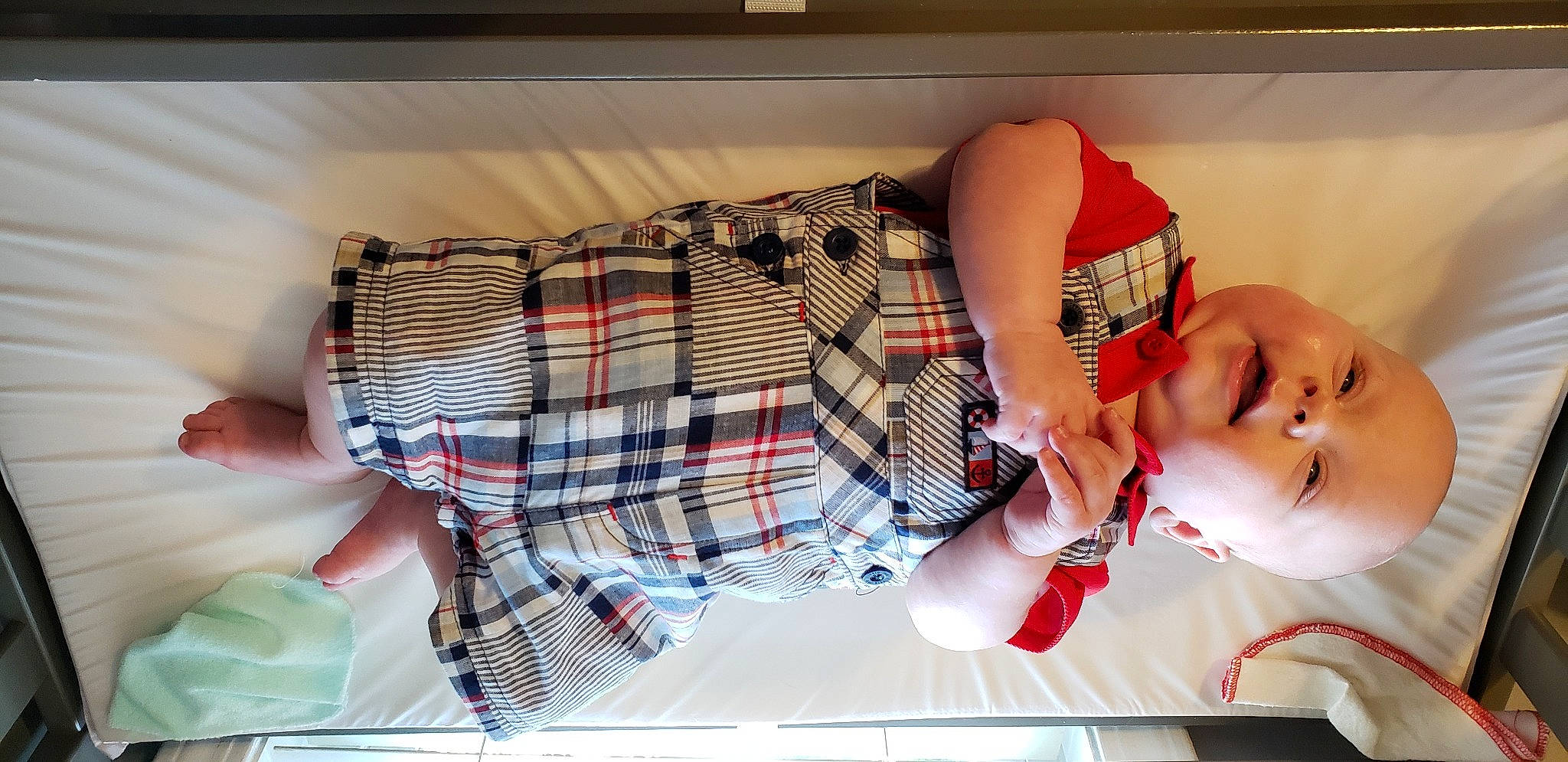 Ridley is registered to the contest to win money with this photo: baby, child, design, hand, leg, mouth, muscle, pattern, person, plaid, tartan