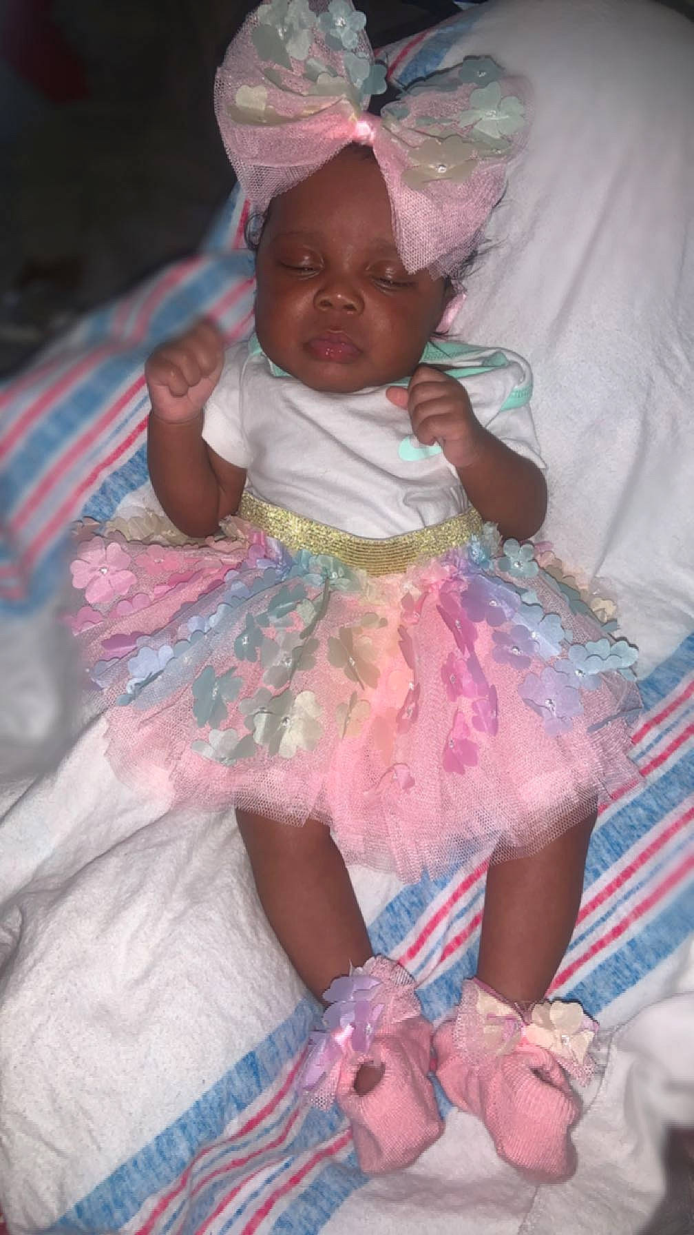 Lani joined the competition — help win amazing prizes! baby, baby_products, baby_toddler_clothing, child, day_dress, dress, embellishment, event, fashion_accessory, fun, happy, magenta, pattern, person, pink, purple, ruffle, sitting, skin, textile